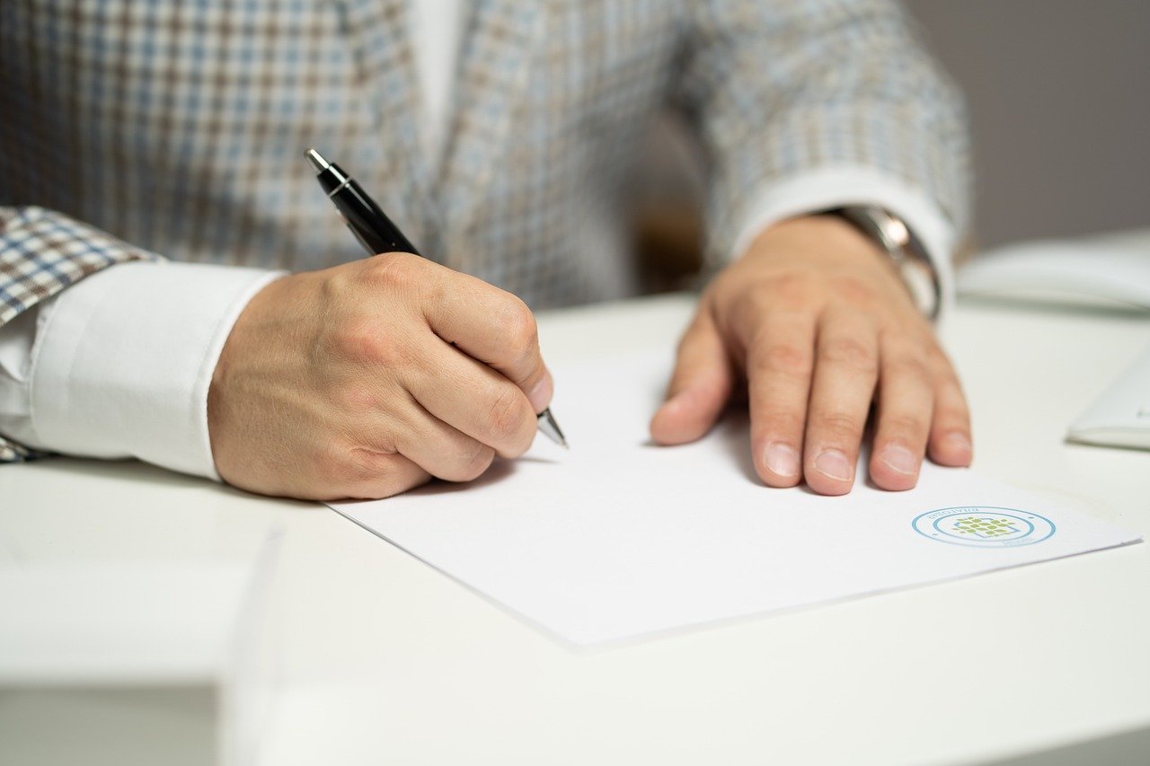 Man signing document